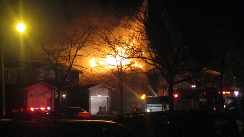 Fire crews work to battle the blaze near Sandalwood Parkway and Kennedy Road, early Tuesday, May 11, 2011. (Sarah Coughlan for CTV News)      