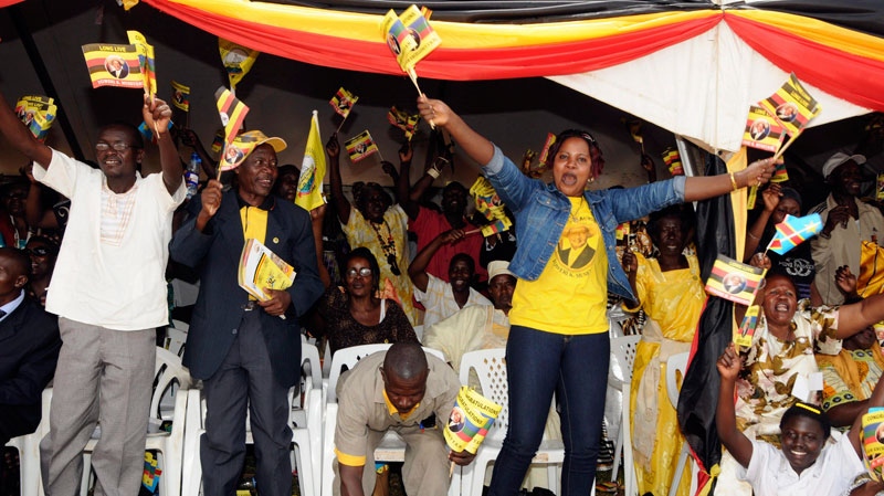 Ugandans react, as Uganda's President Yoweri Museveni is sworn-in, at Kololo Airstrip in the capital city Kampala, Uganda, Thursday, May 12, 2011. (AP  / Stephen Wandera)