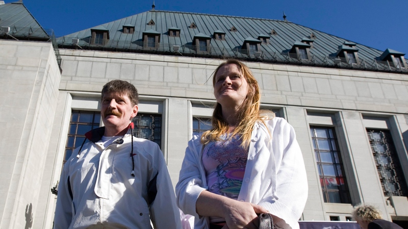 Users of Vancouver's supervised injection site Dean Wilson (left) and Shelly Tomic stand in front of the Supreme Court in Ottawa, Thursday, May 12, 2011. (Adrian Wyld / THE CANADIAN PRESS)  