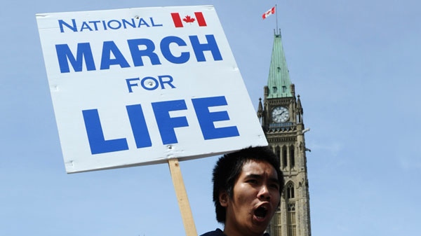 An anti-abortion protester take part in the March for Life on Parliament Hill in Ottawa on Thursday, May 12, 2011. THE CANADIAN PRESS/Sean Kilpatrick