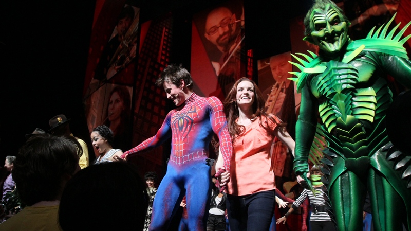 Patrick Page, right, Jennifer Damiano, second from right, Reeve Carney, second from left, and T.V. Carpio, left, react to audience applause during the curtain call for 'Spider-Man: Turn Off The Dark' following the first preview performance of the revamped show at the Foxwoods Theatre in New York Thursday May 12, 2011. The musical returned after a three-week hiatus to fix problems with the show and is scheduled to open June 14. (AP / Tina Fineberg)