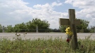 A memorial cross was placed at the scene of the fatal hit-and-run that killed a 30-year-old man on Sunday, Aug. 11, 2013.