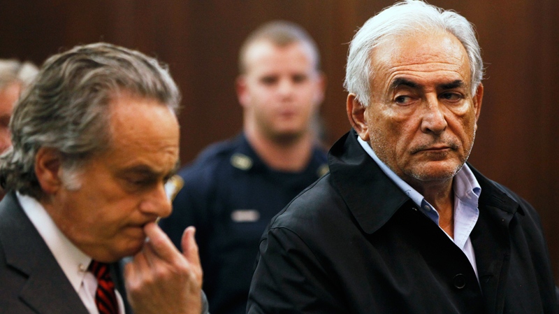 Dominique Strauss-Kahn, right, head of the International Monetary Fund, with his attorney Benjamin Brafman, is arraigned in Manhattan Criminal Court, Monday, May 16, 2011. (AP / Shannon Stapleton)