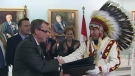 Saskatchewan Premier Brad Wall and Federation of Sasakatchewan Indian Nations Chief Guy Lonechild shake hands after signing an agreement to establish a joint task force on education and employment at the Saskatchewan legislature on Tuesday.