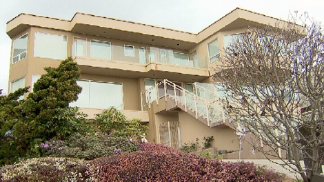 This West Vancouver home is listed under the name Mumtaz Ladha. Neighbours say they recall seeing a timid African woman in the driveway. May 16, 2011. (CTV)