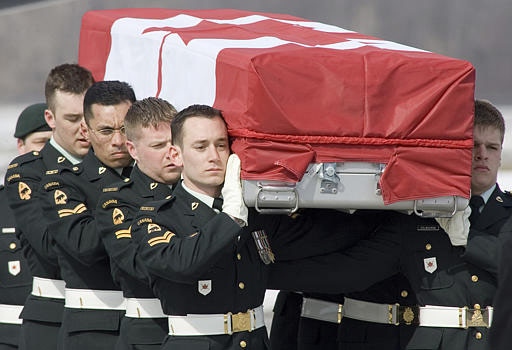 Pallbearers carry the casket of Cpl. Kevin Megeney during his repatriation ceremony at Canadian Forces Base Trenton, Friday, March 9, 2007. (CP / Tom Hanson)