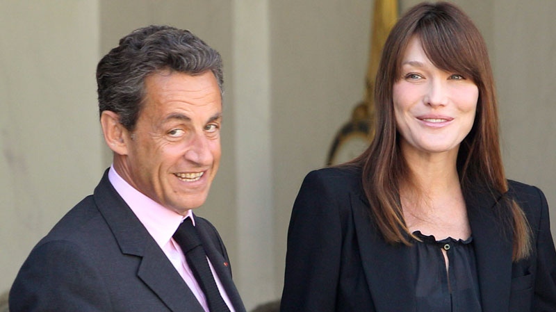 France's President Nicolas Sarkozy, left, his wife Carla Bruni-Sarkozy, right, are seen at the Elysee Palace in Paris, Friday, May 13, 2011. (AP / Michel Euler)