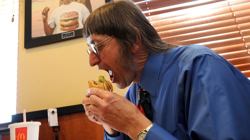 Don Gorske, 59, a retired prison guard, eats his 25,000th Big Mac at a McDonalds in his hometown of Fond du La, Wis., on Tuesday, May, 17, 2011. (AP / The Reporter, Patrick Flood)
