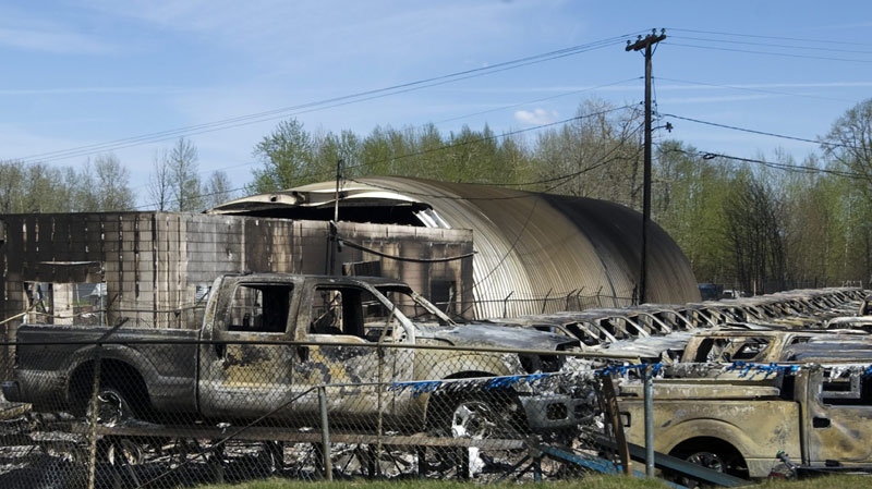 The remains of cars at a dealership in Slave Lake, Alta., on Tuesday, May 17, 2011. A wildfire swept through the town of 7,000 destroying upwards of 40 per cent of the buildings. (THE CANADIAN PRESS\Ian Jackson