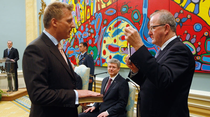 Maxime Bernier is sworn in as Minister of State (Small Business and Toruism) by Clerk of the Privy council Kevin Lynch as Prime Minister Stephen Harper looks on during a ceremony at Rideau Hall in Ottawa, Wednesday, May 18, 2011. (Adrian Wyld / THE CANADIAN PRESS)
