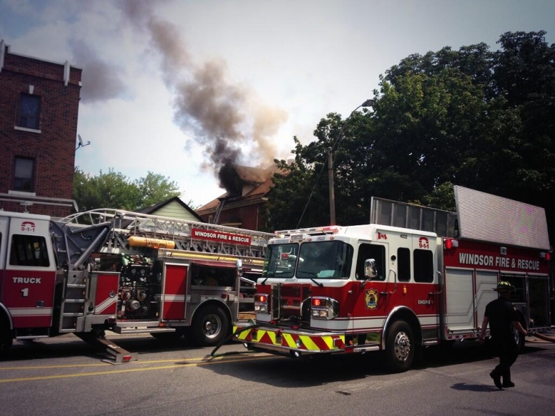 Firefighters battle a blaze at a house on Howard Ave in Windsor, Ont., on Monday, Aug. 19, 2013 (Sacha Long / CTV Windsor) 