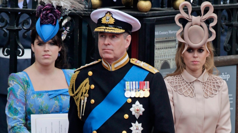 Prince Andrew, centre, and his daughters Princess Eugenie, left, and Princess Beatrice leave Westminster Abbey at the Royal Wedding in London, Friday, April, 29, 2011. (AP / Gero Breloer)