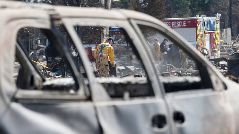 Crews are working in Slave Lake, Alberta, shutting of gas and water in burned out neighbourhoods on Wednesday May 18, 2011. (Ian Jackson / THE CANADIAN PRESS)