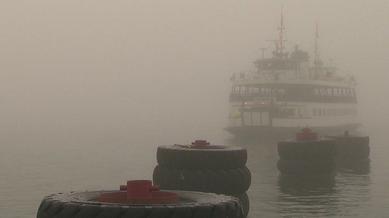 A ferry arrives at the Mainland Ferry Docks in downtown Toronto on a foggy Thursday morning, May 19, 2011.