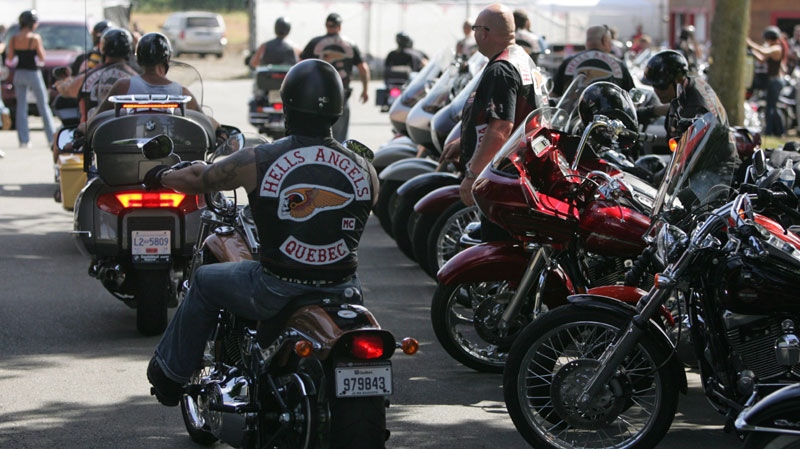 A member of the Hell's Angels motorcycle gang from Quebec arrives at the White Rock, B.C., chapter's property in Langley, B.C., on Friday July 25, 2008. (THE CANADIAN PRESS/Darryl Dyck)