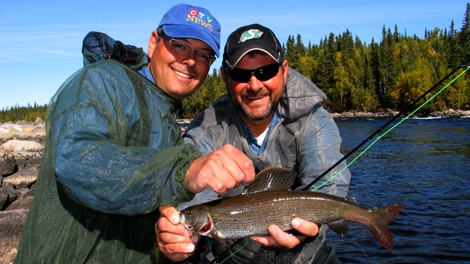 Jeff and Jason holding a gorgeous Arctic Grayling