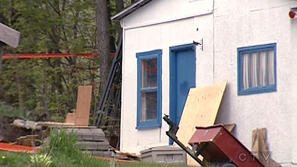 Quebec police have launched an investigation after a body was found in the freezer of a home where a family member was arrested in connection with a murder two years ago.