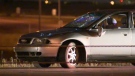 An Audi A4 exhibits visible damage after the vehicle struck a pedestrian on Deerfoot Trail Saturday morning