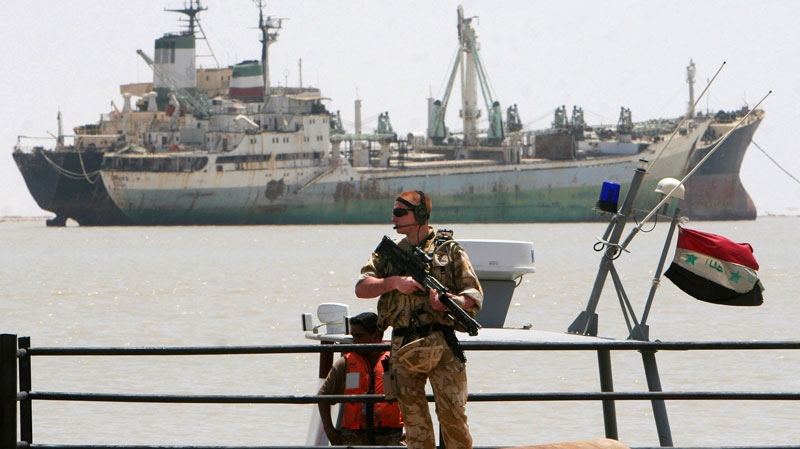 In this photo, a British soldier stands guard at Umm Qasr port in Basra, Iraq, on May 27, 2007. (AP / Khalid Mohammed, File)