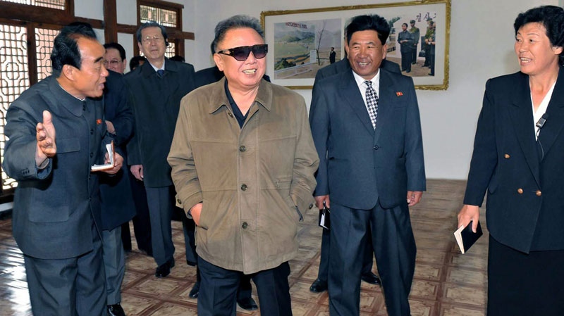 In this undated photo released Thursday, May 19, 2011, by Korean Central News Agency via Korea News Service in Tokyo, North Korean leader Kim Jong Il, center, inspects the Toksong fruit farm, South Hamgyong Province, North Korea. (AP / Korean Central News Agency via Korea News Service) 