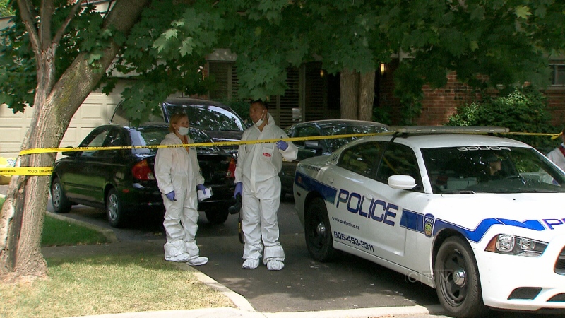 Peel police investigate the murder of Caleb Harrison, 41, in Mississauga, Sunday, Aug. 25, 2013.