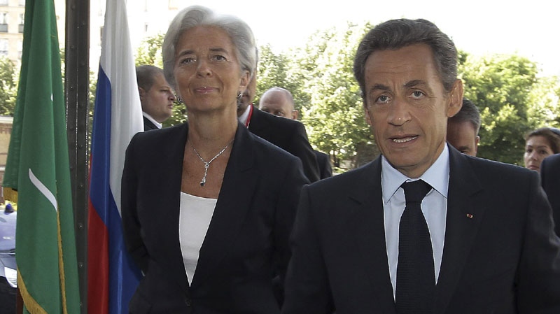 France's President Nicolas Sarkozy, right, and France's Finance and Economy Minister Christine Lagarde arrive for a G20 Globalization conference in Paris, France, Monday May 23, 2011. (AP Photo/Bob Edme, Pool)