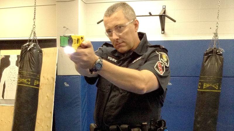 A York Regional Police officer demonstrates how to use a Taser Aug. 27, 2013. (Rob Cooper / CTV Barrie)