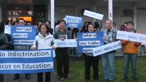 Members of The Parents' Voice picket a Burnaby Board of Education meeting. (YouTube)