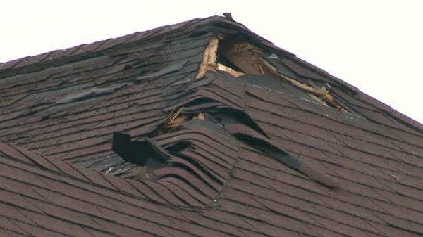 A damaged roof is seen after a lightning bolt struck the roof this Ajax, Ont., house during the thunderstorms on Monday, May 23, 2011.