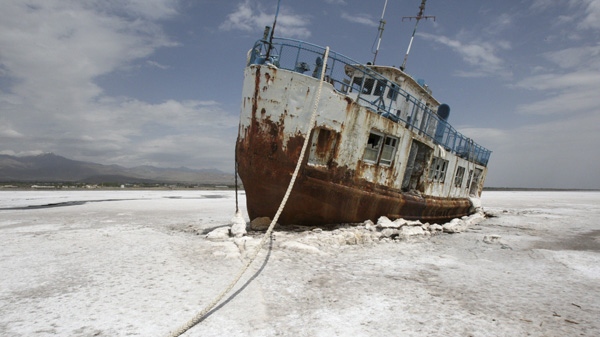 An abandoned ship is stuck in the solidified salts of the Oroumieh Lake, some 600 kilometres northwest of the capital Tehran, Iran, Friday, April 29, 2011. (AP Photo/Vahid Salemi)
