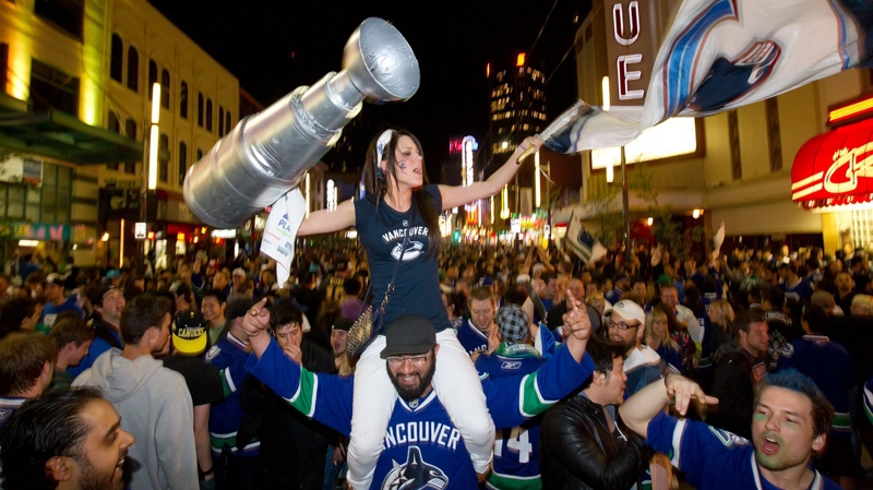 People pack Granville Street in celebration after the Vancouver Canucks advanced to the NHL's Stanley Cup Final after defeating the San Jose Sharks 4-1 in Vancouver, B.C., on Tuesday, May 24, 2011. (Darryl Dyck  / THE CANADIAN PRESS)