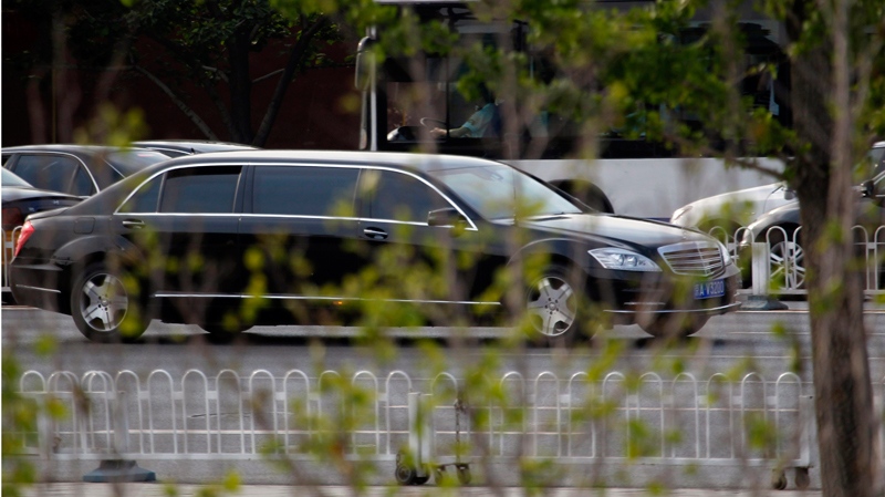 A stretch limousine believed to be carrying North Korean leader Kim Jong Il drives ahead of a convoy of cars travelling towards the Great Hall of the People in Beijing, China, Wednesday, May 25, 2011. (AP / Ng Han Guan)