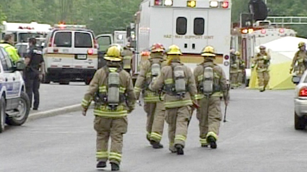 Fire officials arrive at Mother Teresa Catholic High School following an explosion on Thursday, May 26, 2011.