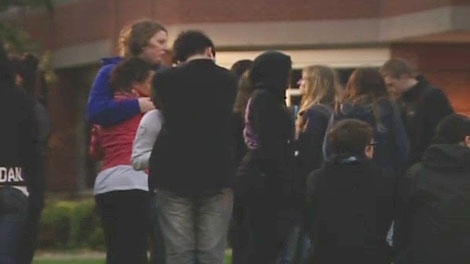 Students gather to mourn the loss of 18-year-old Eric Leighton Thursday, May 26, 2011.