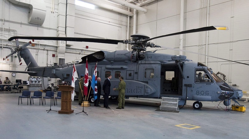 Defence Minister Peter MacKay inspects a new Canadian military Sikorsky CH-148 Cyclone helicopter at 12 Wing Shearwater in Halifax on Thursday May 26, 2011. (THE CANADIAN PRESS/Andrew Vaughan)
