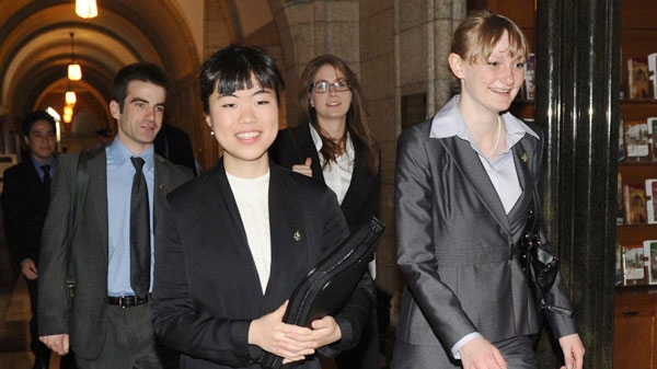 Newly elected New Democratic Party MP's Matthew Dub�, left to right, Laurin Liu, Myl�ne Freeman, and Charmaine Borg, all McGill University students, arrive to join other newly elected members of Parliament to take part in an orientation session on Parliament Hill in Ottawa, on Thursday, May 19, 2011. (Sean Kilpatrick / THE CANADIAN PRESS)