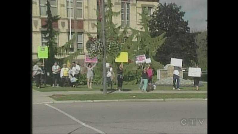Animal welfare protesters march outside the Perth County Courthouse in Stratford, Ont. on Wednesday, Sept. 4, 2013.