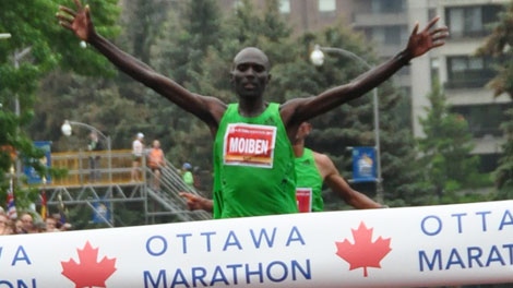 Laban Moiben, of Kenya, crosses the finish line, finishing first in the men's marathon in Ottawa, Sunday, May 28, 2011.