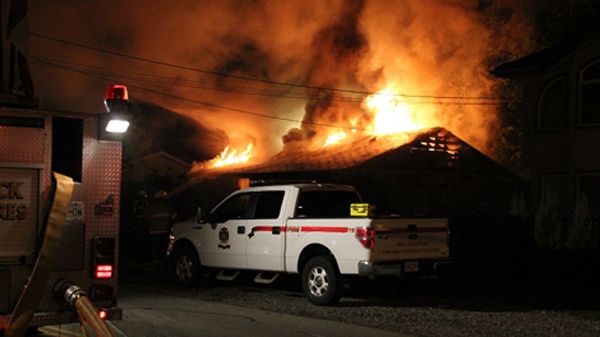 Fire crews battle three separate blazes in Port Coquitlam, B.C. overnight, Saturday, May 28, 2011.