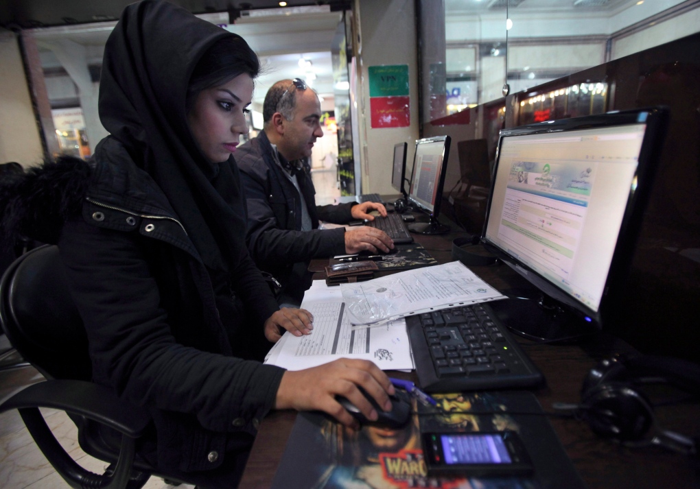 Iranians surf the web at a cyber cafe in Tehran