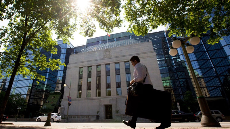 A man walks past the Bank of Canada in Ottawa, Tuesday May 31, 2011.  (Adrian Wyld / THE CANADIAN PRESS)