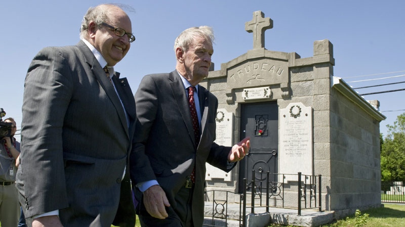 Former prime minister Jean Chretien and former principal secretary to Pierre Trudeau Tom Axworthy, left, walk away after laying a wreath at the gravesite of former prime minister Pierre Elliott Trudeau Wednesday, June 1, 2011, in Saint-Remi,Que. (THE CANADIAN PRESS/Paul Chiasson)