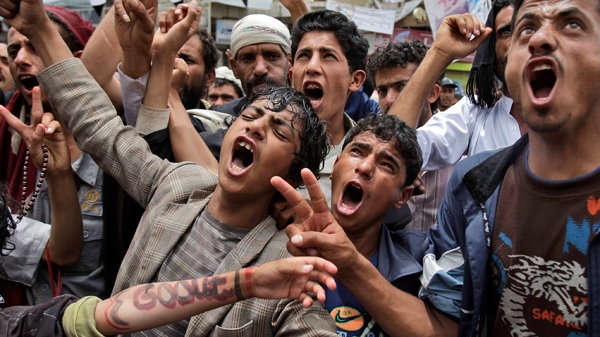Anti-government protestors shout slogans during a demonstration demanding the resignation of Yemeni President Ali Abdullah Saleh, in Sanaa, Yemen, Thursday, June 2, 2011. (AP / Hani Mohammed) 