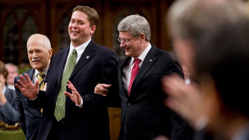 Then-Speaker of the House of Commons Andrew Scheer jokingly tries to fight with then-Prime Minister Stephen Harper and then-NDP leader Jack Layton as they escort him to the Speakers chair in the House of Commons on Parliament Hill in Ottawa, Thursday June 2, 2011. (Adrian Wyld / THE CANADIAN PRESS)