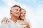 A middle-aged couple smile. (@HannaMonika / Shutterstock.com)