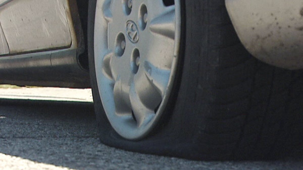 One of about three dozen tires slashed in Ingersoll, Ont. is seen on Friday, June 3, 2011.