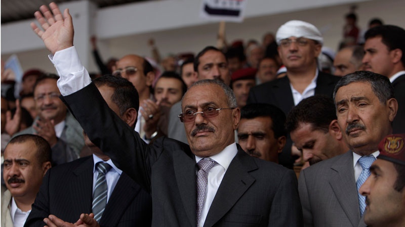In this photo, Yemeni President Ali Abdullah Saleh, center, waves to his supporters during a rally in Sanaa, Yemen, Friday, April 29, 2011. (AP / Muhammed Muheisen)