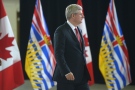 Prime Minister Stephen Harper enters a news conference in Richmond, B.C. on Monday, Sept. 16, 2013. (THE CANADIAN PRESS/Jonathan Hayward)
