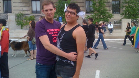 Ron Harder and Kyle Ross take in activites at the Winnipeg Pride Festival.
