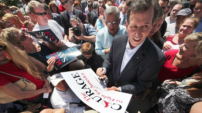 Former Pennsylvania Sen. Rick Santorum works the crowd after announcing he is entering the Republican presidential race, at the Somerset County Courthouse in Somerset, Pa, Monday, June 6, 2011. (AP / Gene J. Puskar)